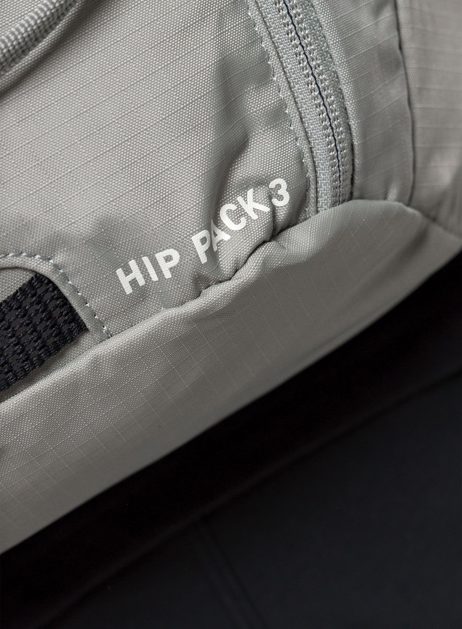 Biciklistička torbica oko struka Evoc Hip Pack 3 - stone