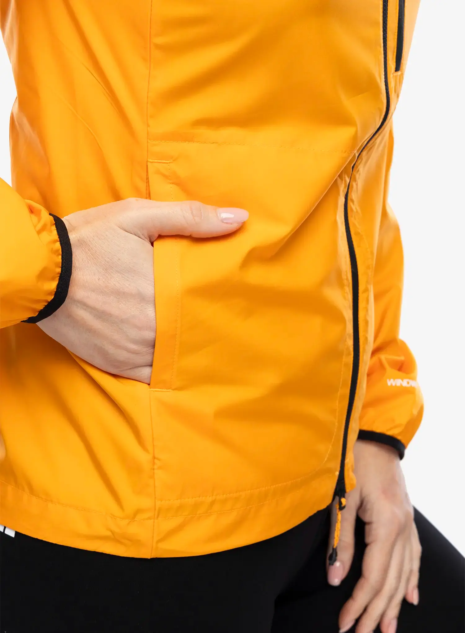 Ženska vjetrovka The North Face Higher Run Wind Jacket - apricot glaze/iron citrus